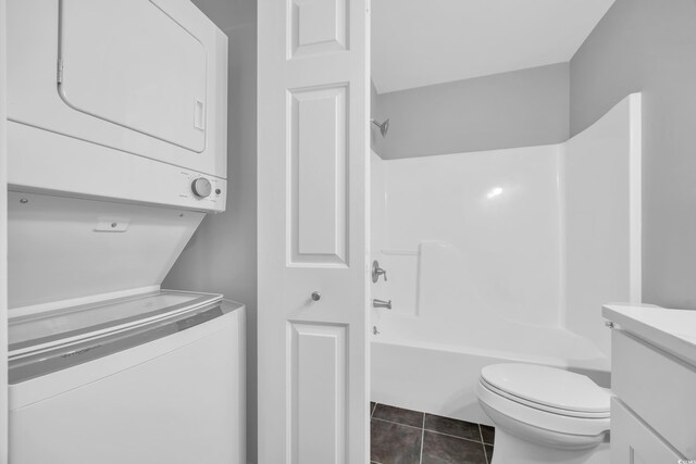 1260 White Tree Ln Unit F, Myrtle Beach, SC 29588 - bathroom with stacked washer and dryer, shower / tub combination, tile patterned flooring, vanity, and toilet