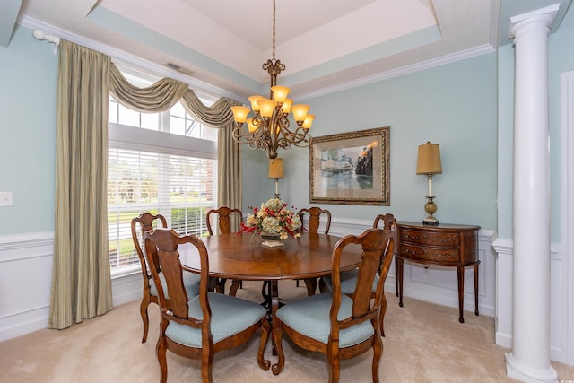 912 Berwick Ln, Myrtle Beach, SC 29579 - dining area featuring a chandelier, ornate columns, light colored carpet, a raised ceiling, and healthy amount of natural light