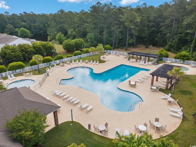 1097 Stoney Falls Blvd, Myrtle Beach, SC 29579 - community pool featuring a wooded view, a pergola, and a patio