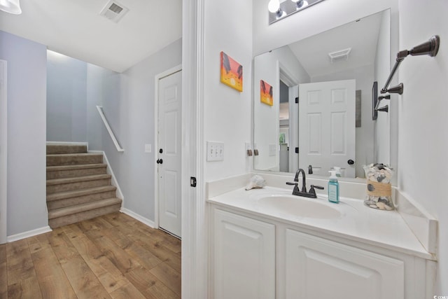 1097 Stoney Falls Blvd, Myrtle Beach, SC 29579 - bathroom featuring wood finished floors, vanity, vaulted ceiling, and baseboards
