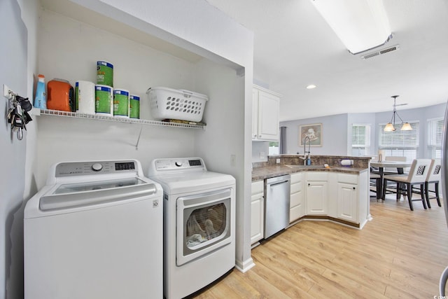 1097 Stoney Falls Blvd, Myrtle Beach, SC 29579 - washroom with washing machine and clothes dryer, light wood-type flooring, and recessed lighting