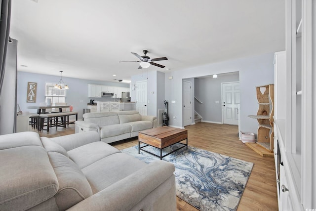 1097 Stoney Falls Blvd, Myrtle Beach, SC 29579 - living area with ceiling fan, stairway, light wood finished floors, and baseboards