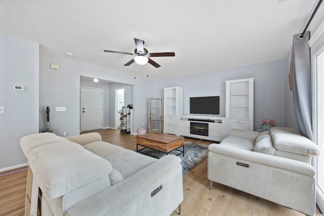 1097 Stoney Falls Blvd, Myrtle Beach, SC 29579 - living room featuring ceiling fan, light wood-style flooring, and baseboards