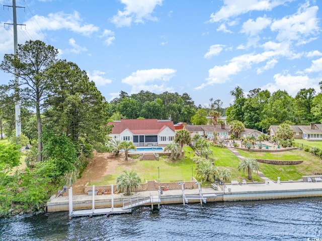128 Causey St, Myrtle Beach, SC 29577 - back of house featuring a water view, an outdoor pool, and a lawn