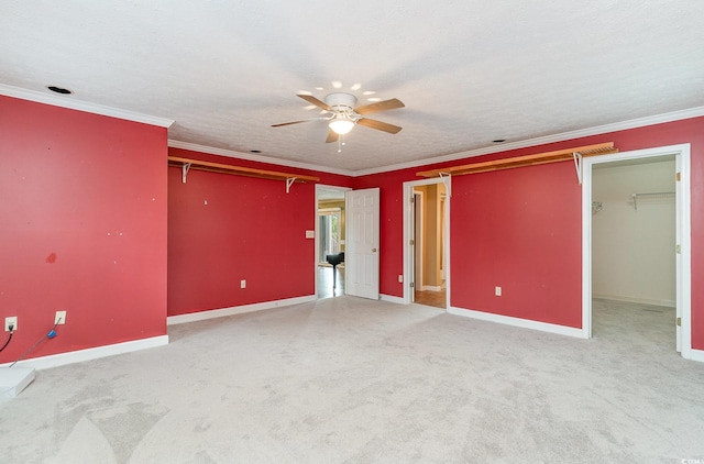 128 Causey St, Myrtle Beach, SC 29577 - unfurnished bedroom with baseboards, carpet floors, a walk in closet, and crown molding