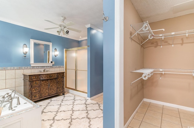 128 Causey St, Myrtle Beach, SC 29577 - bathroom featuring a shower stall, a ceiling fan, a bath, a spacious closet, and vanity