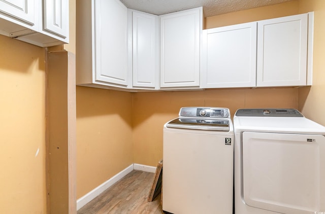 128 Causey St, Myrtle Beach, SC 29577 - laundry room featuring washer and dryer, light wood finished floors, baseboards, and cabinet space