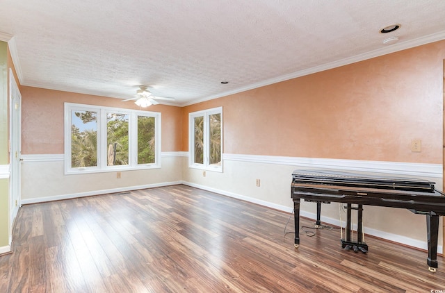 128 Causey St, Myrtle Beach, SC 29577 - unfurnished room with wood finished floors, ceiling fan, a textured ceiling, ornamental molding, and baseboards