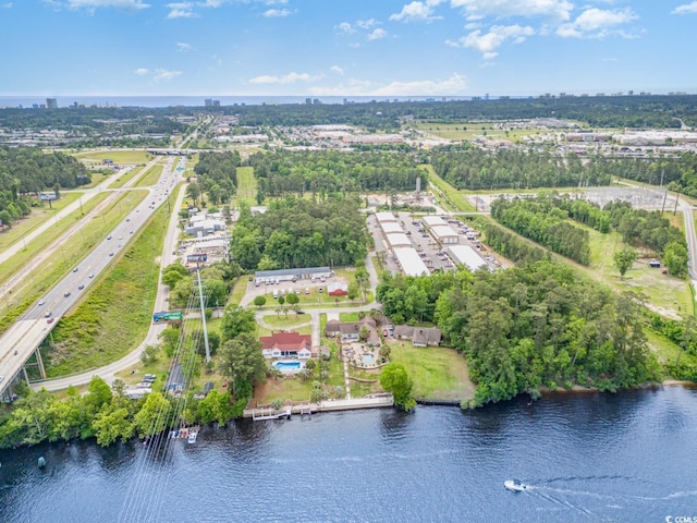 128 Causey St, Myrtle Beach, SC 29577 - drone / aerial view of a major roadway, a tree filled landscape, and a large body of water