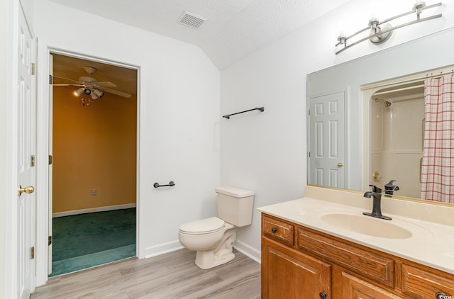 128 Causey St, Myrtle Beach, SC 29577 - bathroom with vanity, wood finished floors, toilet, a ceiling fan, and baseboards