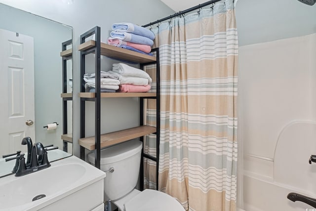 bathroom with a sink, toilet, and shower / tub combo with curtain