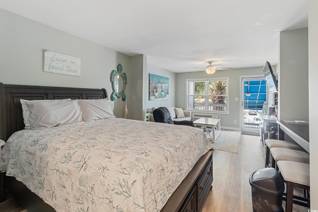 bedroom featuring access to exterior, light wood-type flooring, baseboards, and ceiling fan