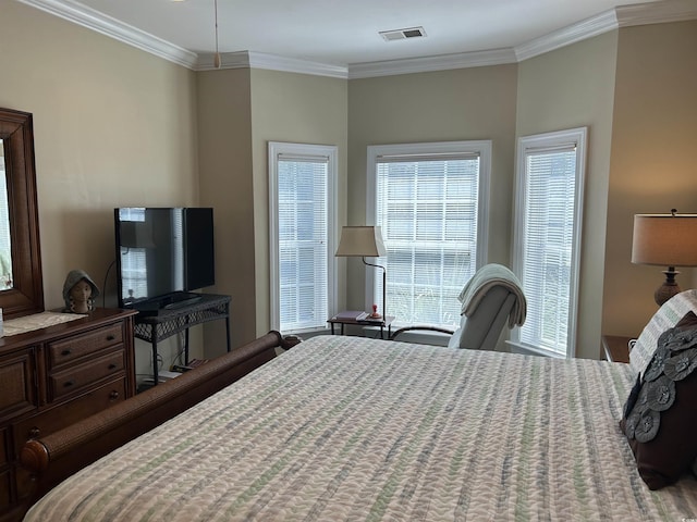bedroom featuring crown molding and visible vents