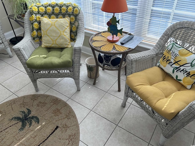 interior space with baseboards and tile patterned floors