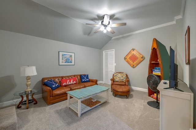 living area featuring crown molding, carpet floors, a ceiling fan, baseboards, and vaulted ceiling