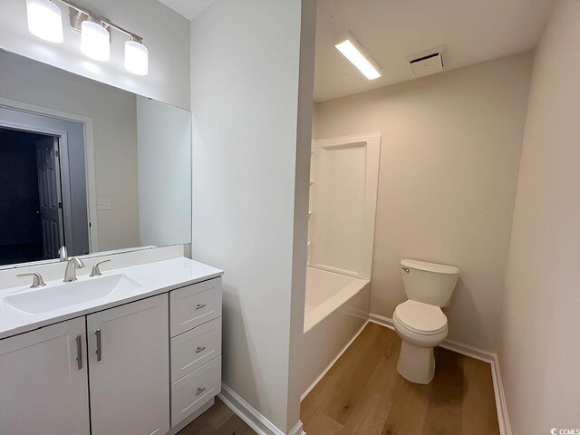 116 Hickory Dr, Conway, SC 29526 - bathroom featuring toilet, baseboards, visible vents, vanity, and wood finished floors
