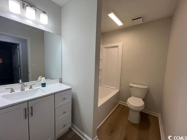 116 Hickory Dr, Conway, SC 29526 - full bath featuring toilet, wood finished floors, vanity, visible vents, and baseboards
