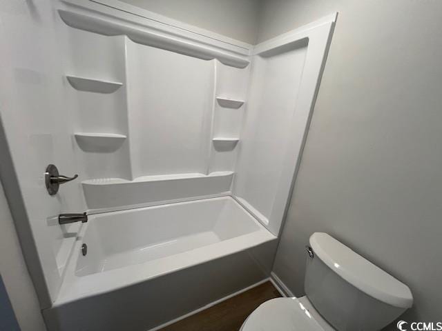 bathroom with toilet and shower / bathing tub combination