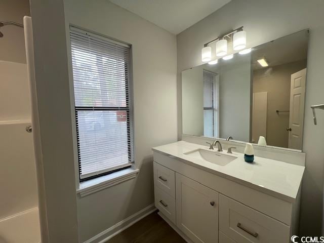 bathroom with vanity and baseboards