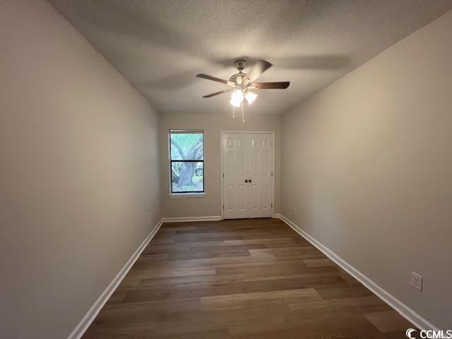 116 Hickory Dr, Conway, SC 29526 - doorway with ceiling fan, a textured ceiling, baseboards, and dark wood-type flooring