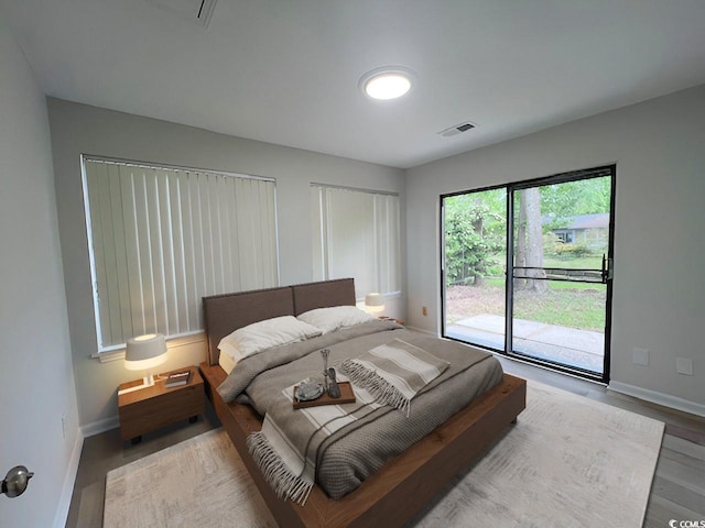 116 Hickory Dr, Conway, SC 29526 - bedroom with wood finished floors, visible vents, baseboards, and access to exterior