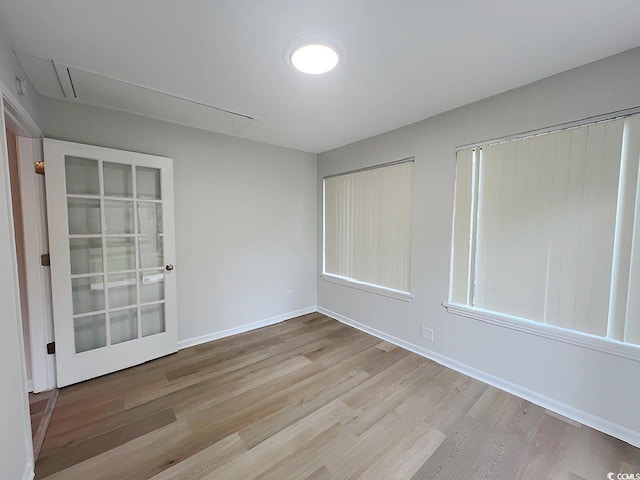 116 Hickory Dr, Conway, SC 29526 - empty room featuring attic access, wood finished floors, and baseboards