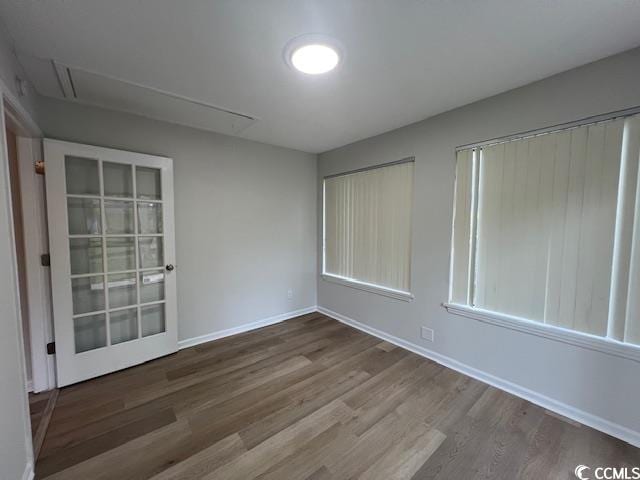116 Hickory Dr, Conway, SC 29526 - spare room featuring baseboards, attic access, and wood finished floors