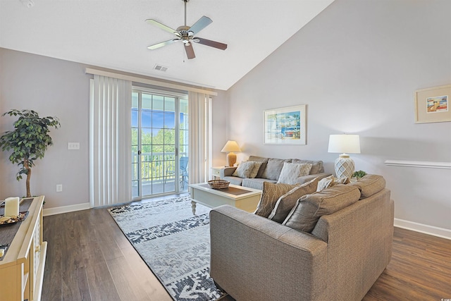 living area with ceiling fan, visible vents, dark wood finished floors, baseboards, and high vaulted ceiling
