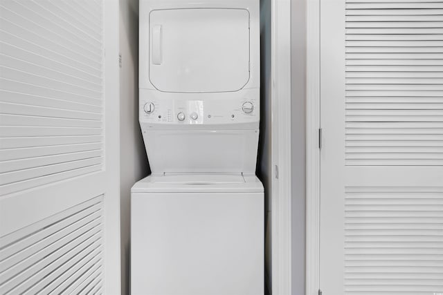 laundry area with laundry area and stacked washing maching and dryer