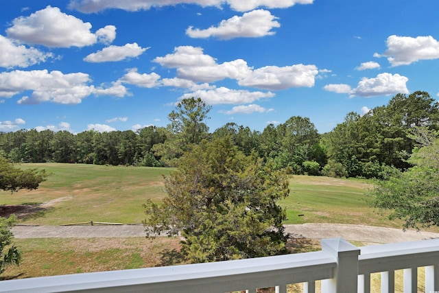 view of yard with view of golf course