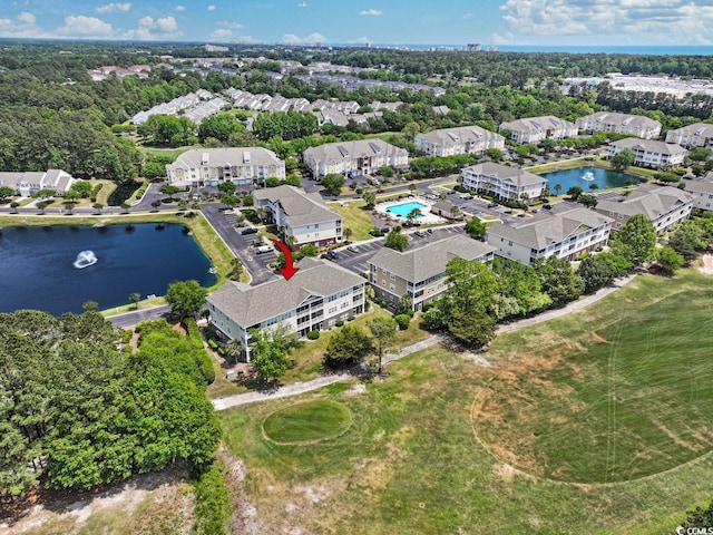 birds eye view of property with a water view
