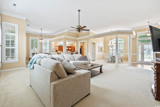127 Willow Bay Dr, Murrells Inlet, SC 29576 - carpeted living room with crown molding, ceiling fan with notable chandelier, baseboards, decorative columns, and visible vents