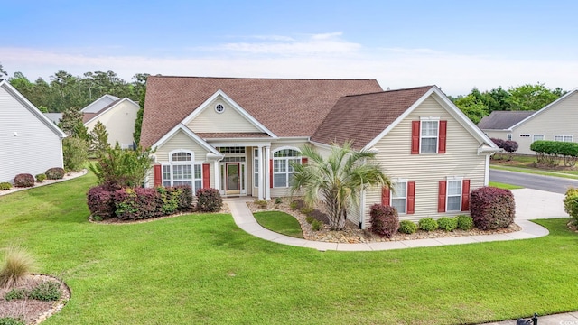 127 Willow Bay Dr, Murrells Inlet, SC 29576 - view of front of home featuring a shingled roof and a front yard