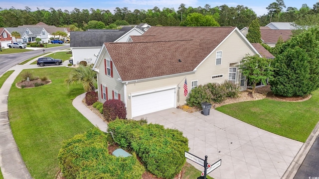 127 Willow Bay Dr, Murrells Inlet, SC 29576 - view of front facade with roof with shingles, a residential view, a front lawn, a garage, and driveway