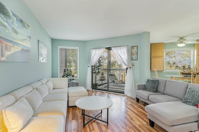 living room featuring light wood-style floors and ceiling fan