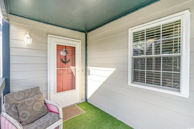doorway to property with a porch