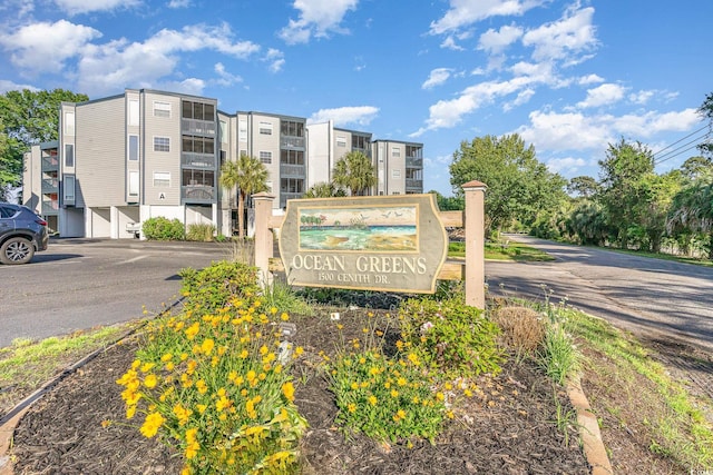community sign with uncovered parking
