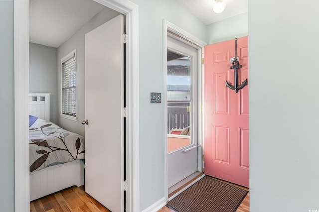 foyer entrance with light wood-style flooring