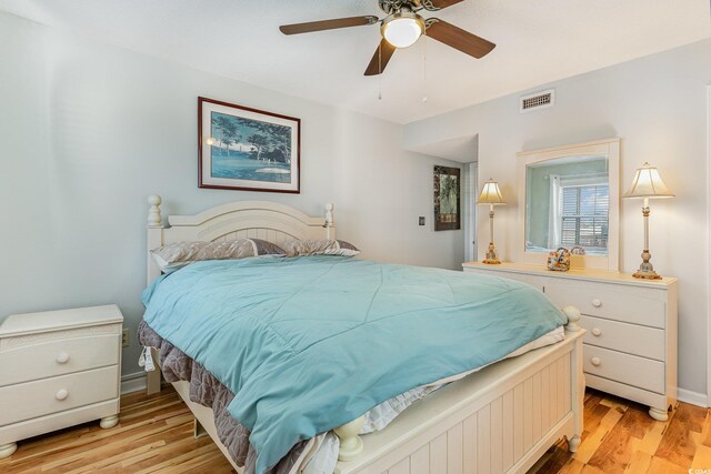 bedroom featuring light wood-style flooring and a ceiling fan