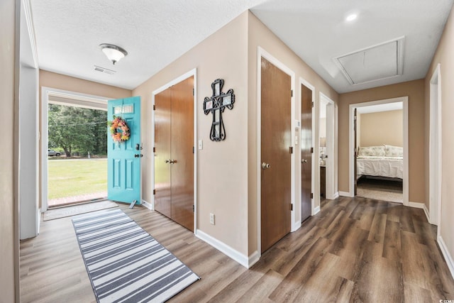 153 Busbee St, Conway, SC 29526 - hallway with attic access, wood finished floors, and baseboards