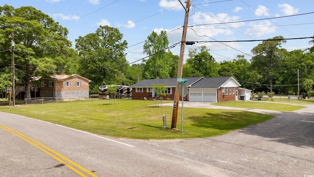 153 Busbee St, Conway, SC 29526 - ranch-style home featuring driveway, brick siding, view of scattered trees, and an attached garage
