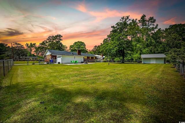 153 Busbee St, Conway, SC 29526 - yard at dusk with view of wooded area