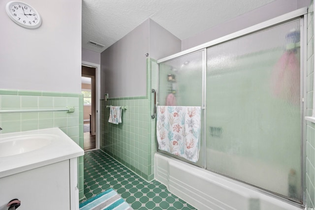 153 Busbee St, Conway, SC 29526 - bathroom with tile walls, bath / shower combo with glass door, tile patterned flooring, wainscoting, and vanity