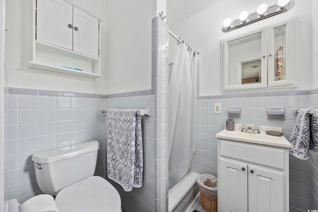 153 Busbee St, Conway, SC 29526 - bathroom with tile walls, a wainscoted wall, a shower stall, toilet, and vanity