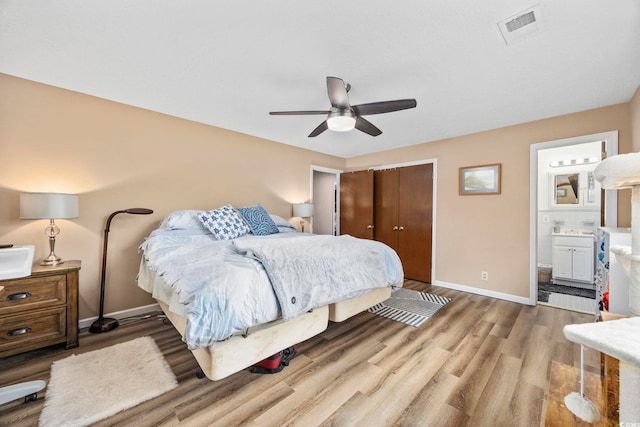 153 Busbee St, Conway, SC 29526 - bedroom with wood finished floors, baseboards, a closet, connected bathroom, and a ceiling fan
