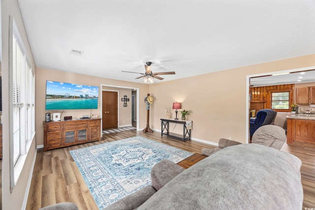 153 Busbee St, Conway, SC 29526 - living area with light wood-style flooring, ceiling fan, and baseboards