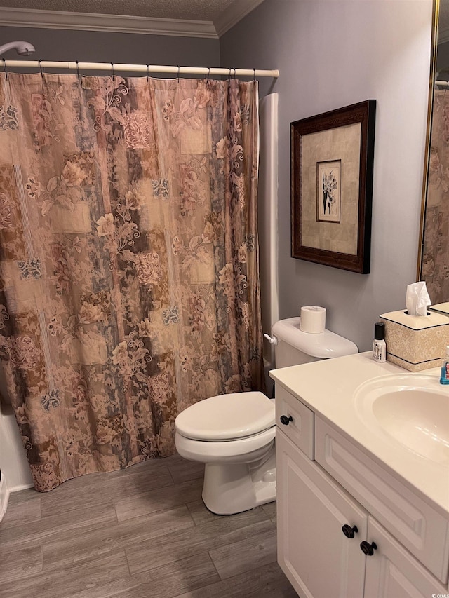 full bath with wood finished floors, curtained shower, vanity, toilet, and ornamental molding