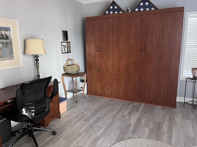home office with light wood-style floors and baseboards
