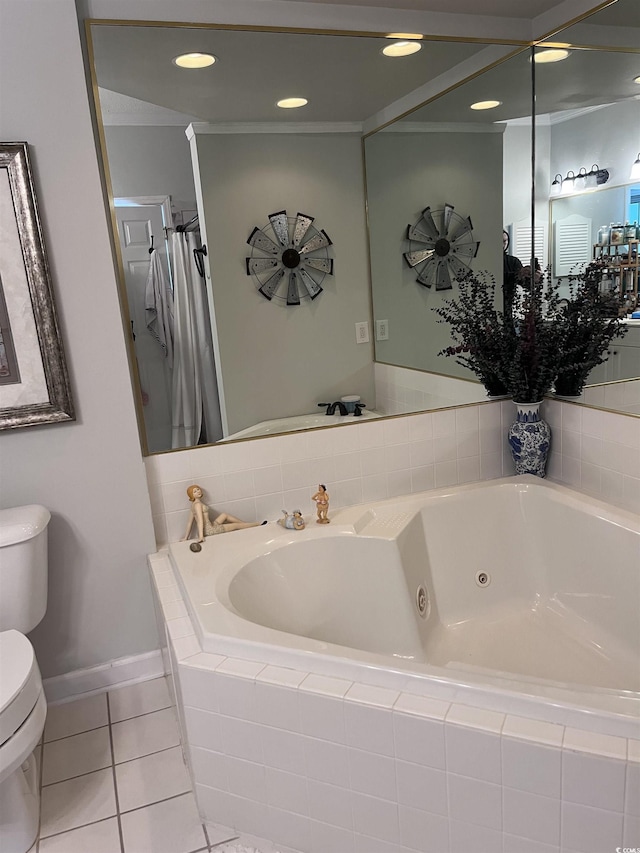 full bathroom with tile patterned floors, a tub with jets, baseboards, and toilet