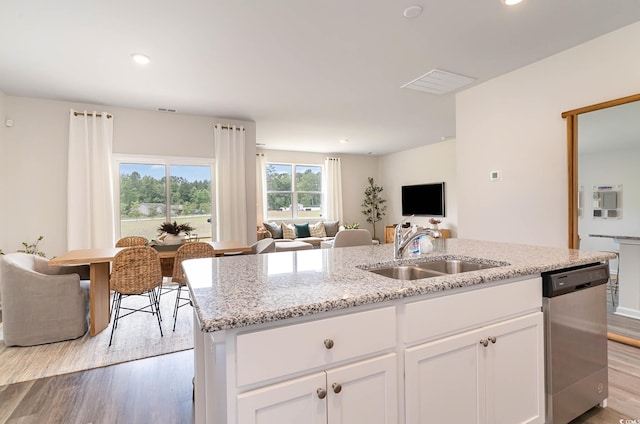 2884 Riverboat Way, Conway, SC 29526 - kitchen with dishwasher, light wood-style floors, open floor plan, a kitchen island with sink, and white cabinets
